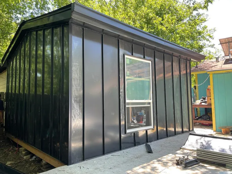 Black standing seam metal wall panels for Roof Inspection in Pearl